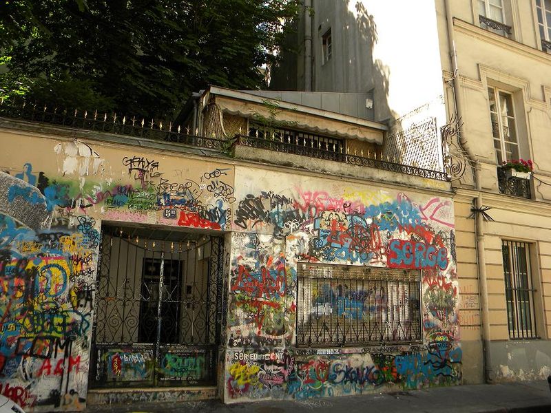 The graffiti-covered wall of Serge Gainsbourg's house, rue de Verneuil
